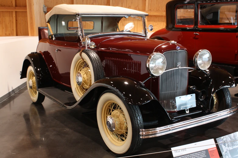 a very nice old classic car in a showroom