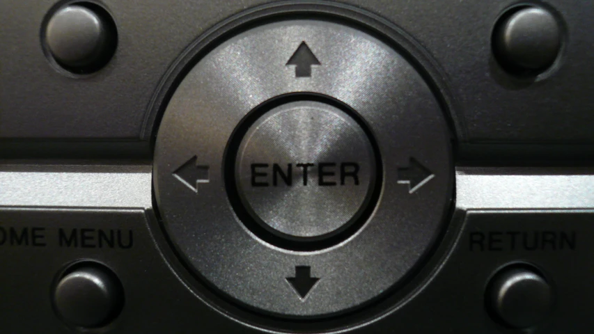a close - up of the center ons on a black remote control