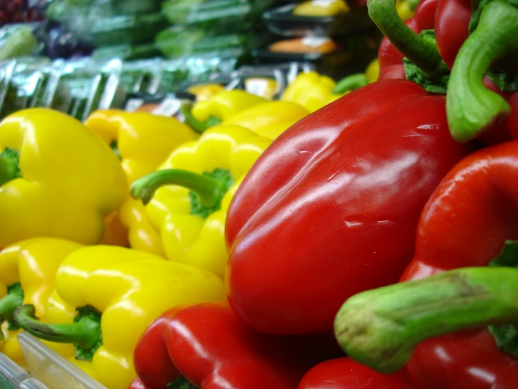 a bunch of peppers that are sitting together