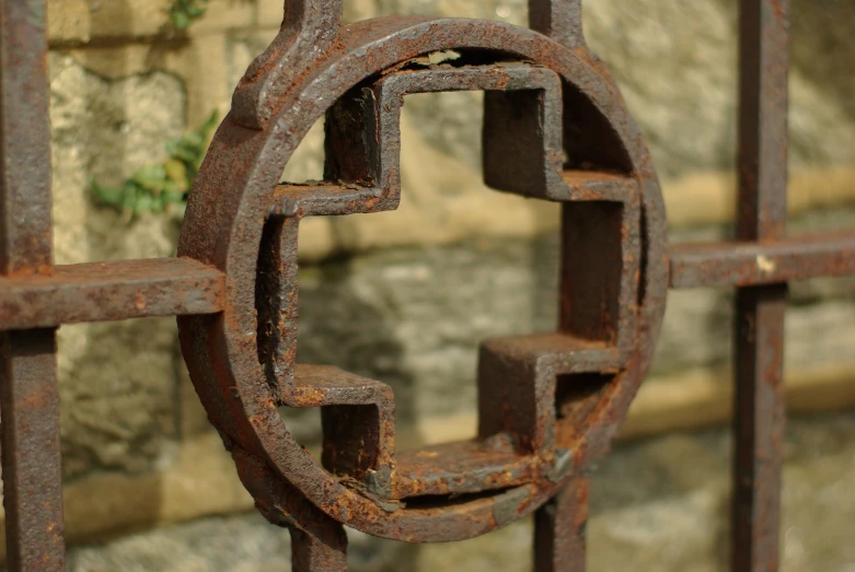 an iron iron gate with no railing in front of the wall