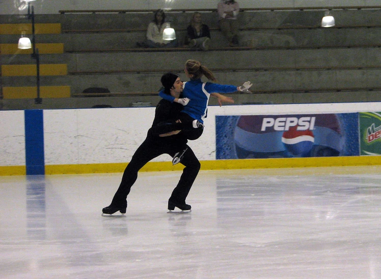 people playing with a ball on an ice rink