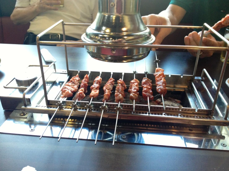 the food is getting on a conveyor belt