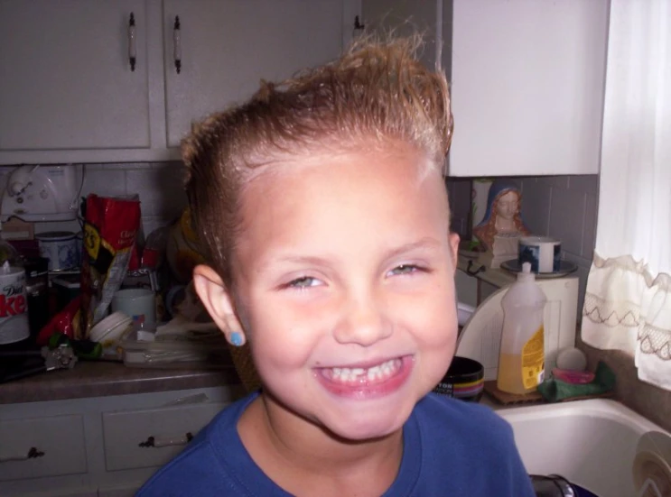 the  has blonde hair in the kitchen