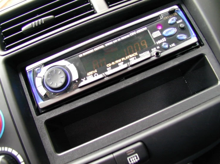the radio in a car is displaying the time