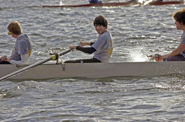 the rowers are using their rowing sticks and rowers