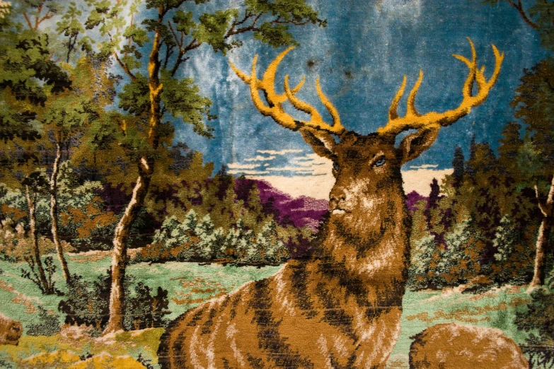 a very nice elk tapestry in a beautiful forest setting