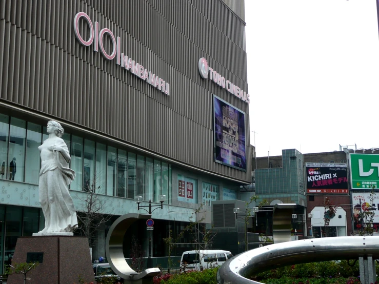 the statue is in front of the building