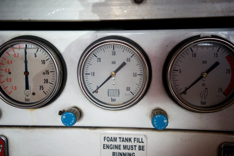 four gauges on top of a vehicle that reads from tank fill, engine must be running