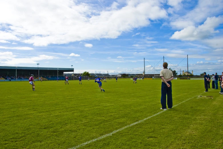 a group of people on a field playing soccer