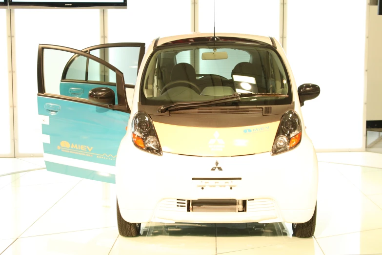 an electric vehicle is parked in front of another vehicle