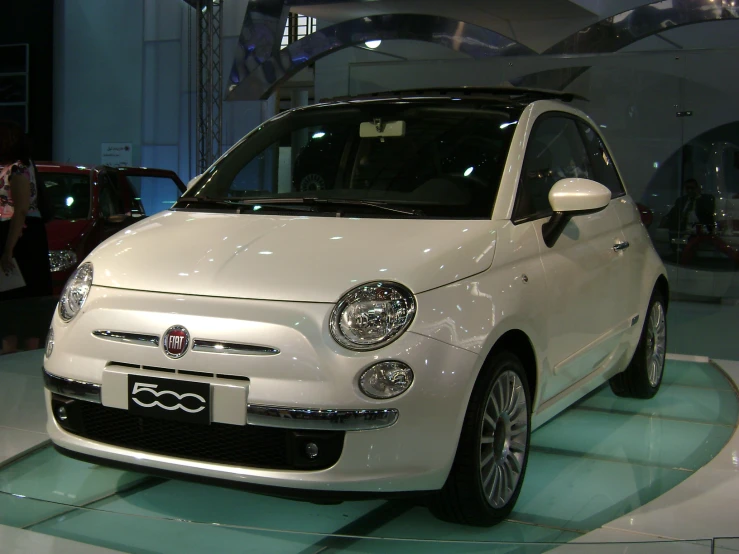 this is an image of a white and blue fiat ape
