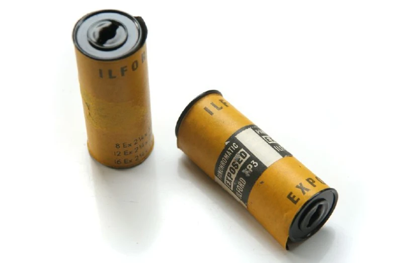 a close up of two batteries on a table
