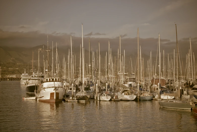 a harbor full of boats and ships during the day