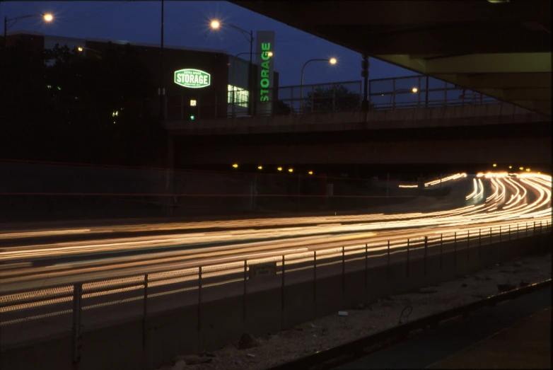 a highway in the evening with traffic going by