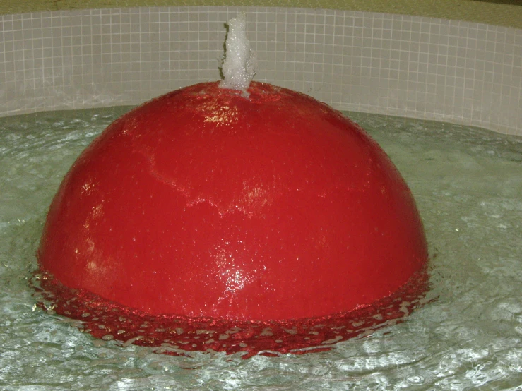 a big ball in the water of a pool