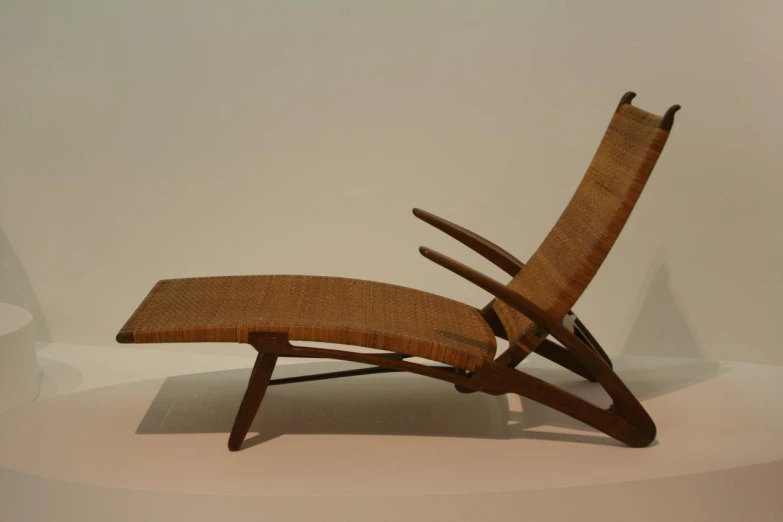 this is a unique chair designed in wood and fabric