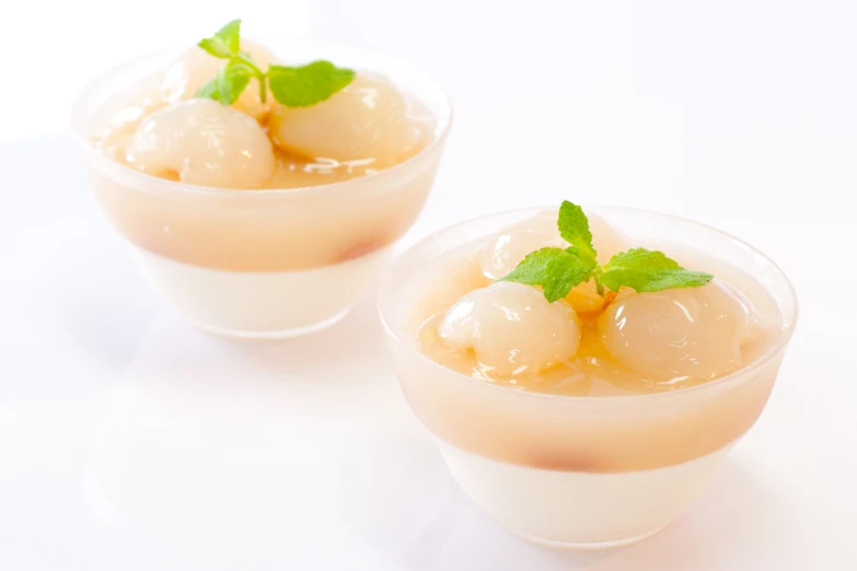 ice cream with mint garnish in small bowls