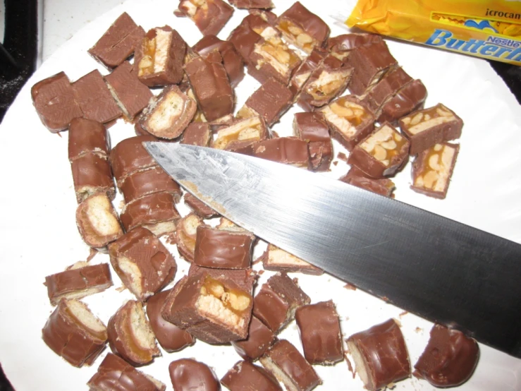 a knife is laying on top of some chocolates