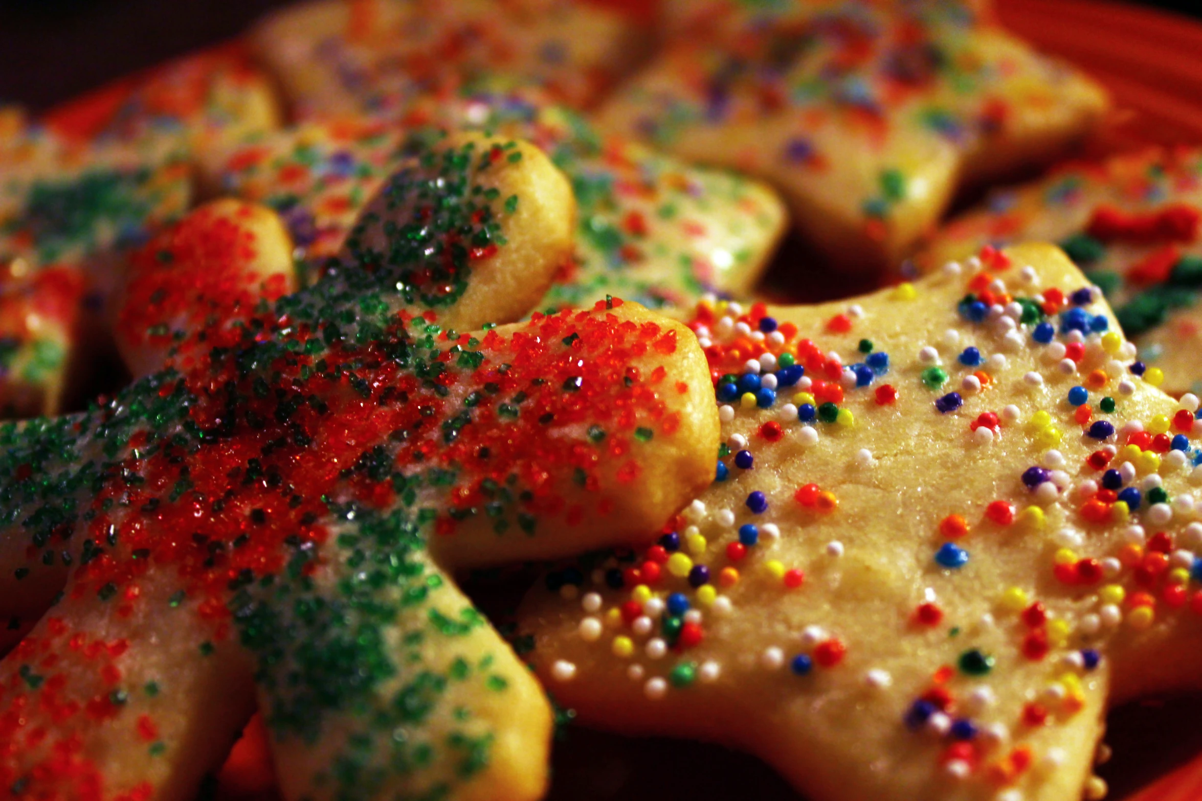 star shaped treats are arranged with colored sprinkles