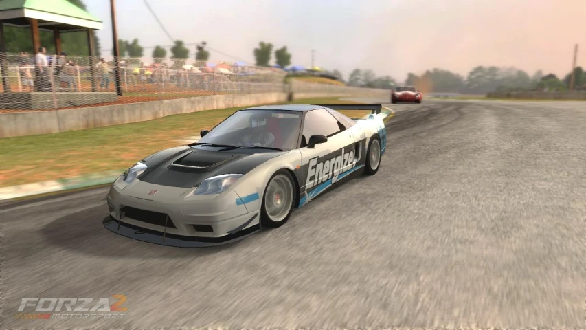 a computer generated image of a car driving on an asphalt track