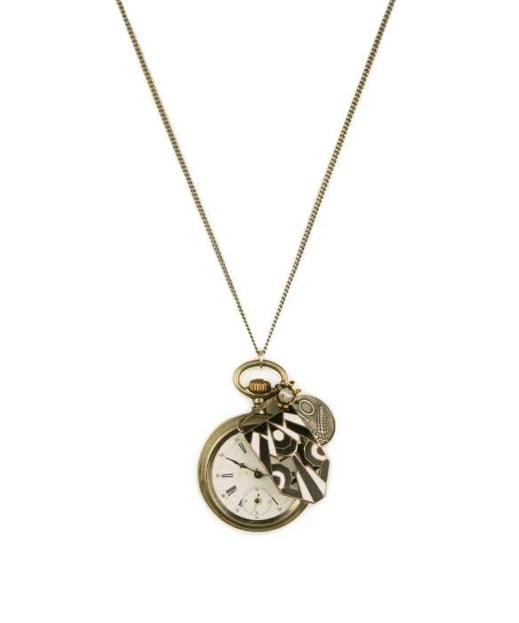 an open pocket watch on a necklace with a key