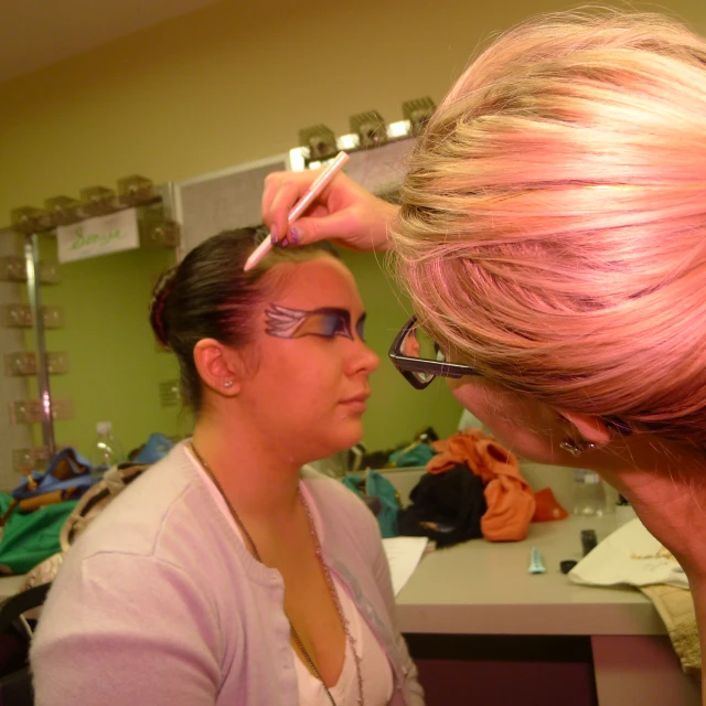 a woman is getting ready for her haircut