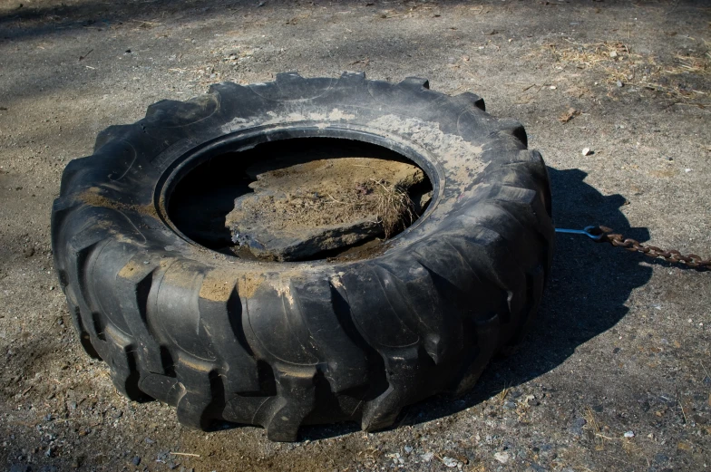 a tire and tire with dirt inside of it