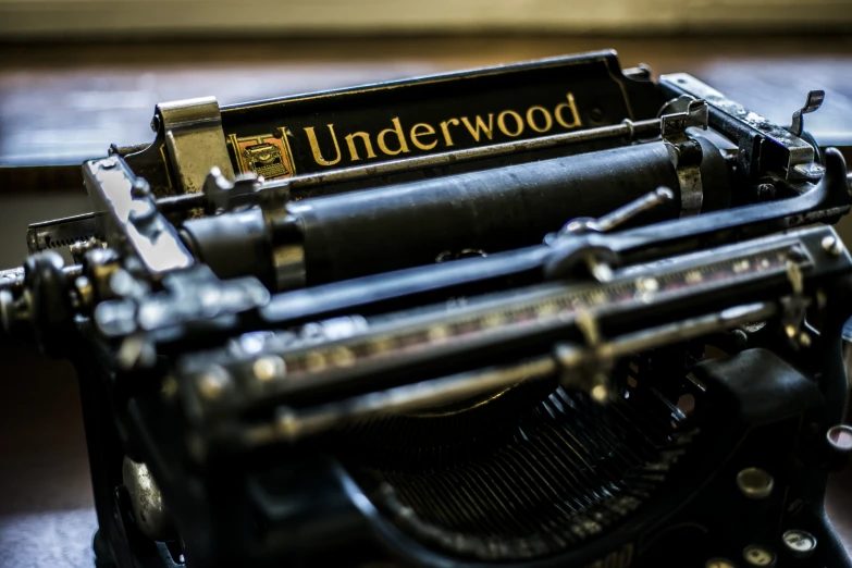 old vintage typewriter with wooden underwod on table