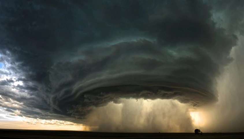 a very big dark cloud with heavy rain hitting on it