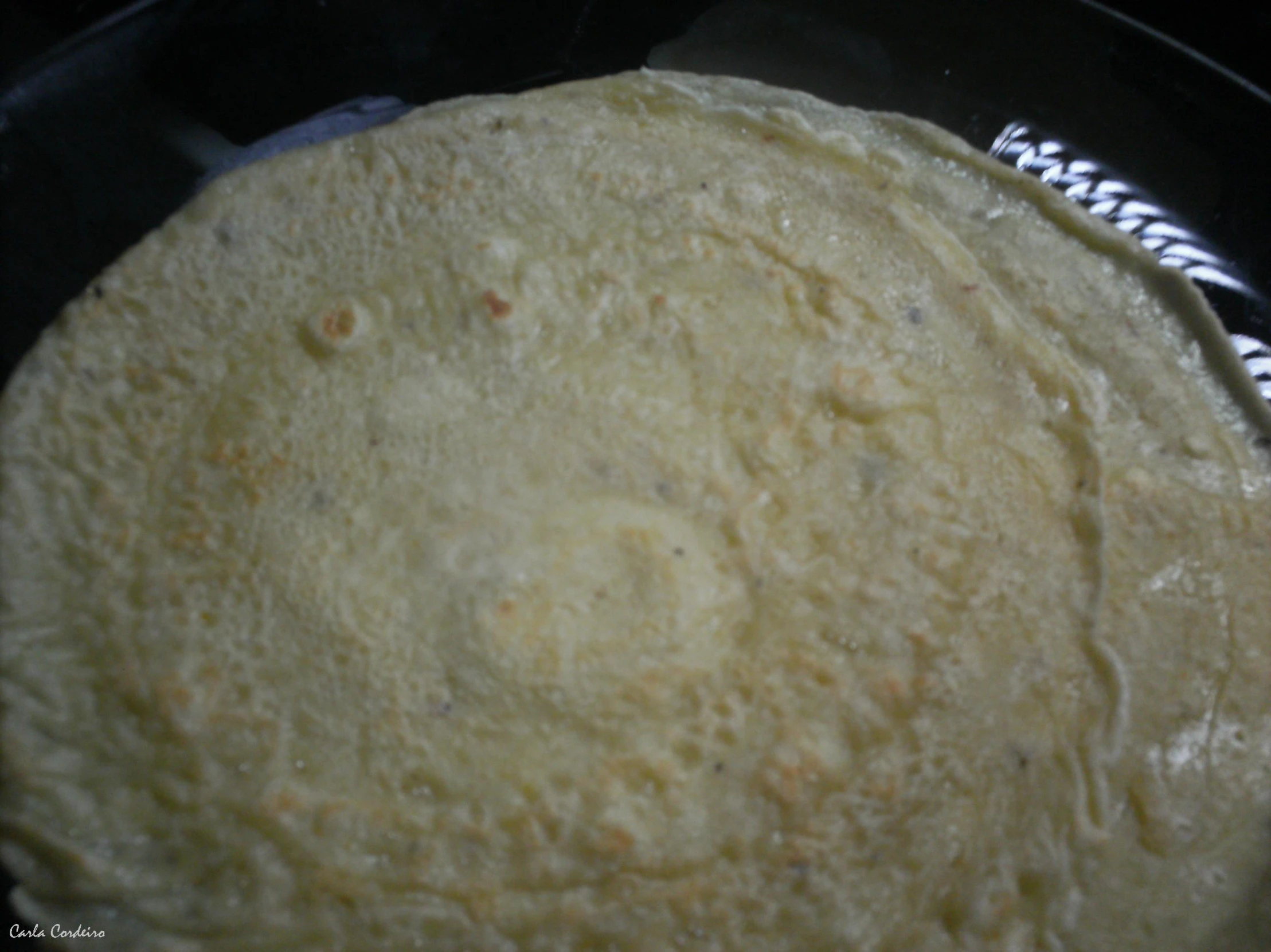 a plate with a freshly baked tortilla in it