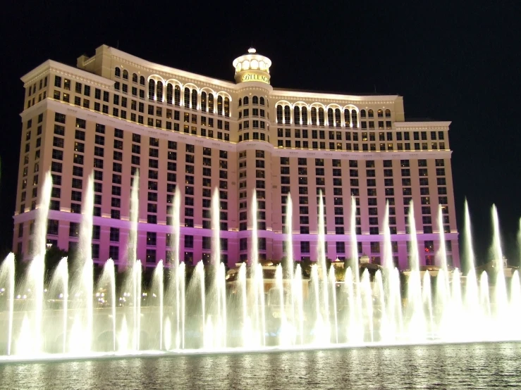 the fountains in front of the mirage el and casino are visible at night