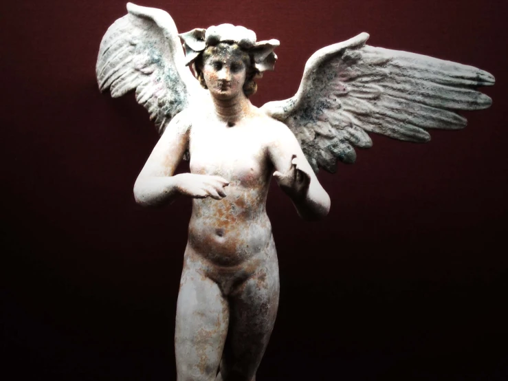 statue of an angel with huge wings