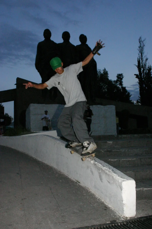 skateboarder in the air on a cement ledge and doing tricks