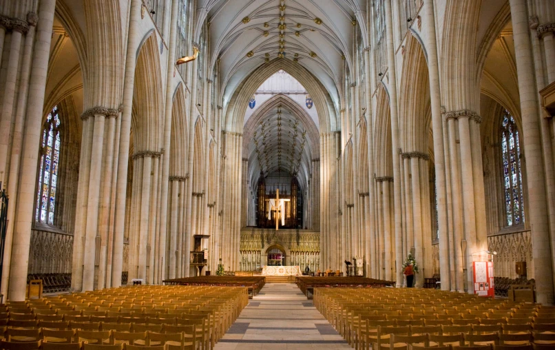 a po taken inside a cathedral with wooden pews