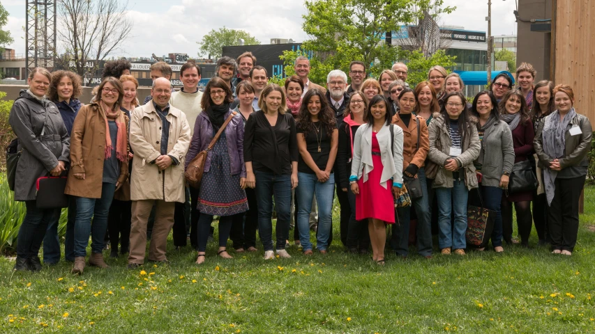 a large group of people posing for a po