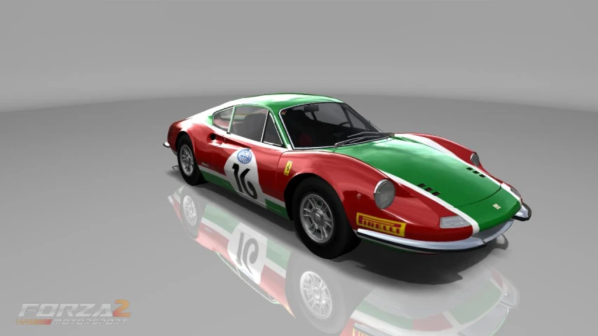 a red, white and green vintage racing car on a gray background