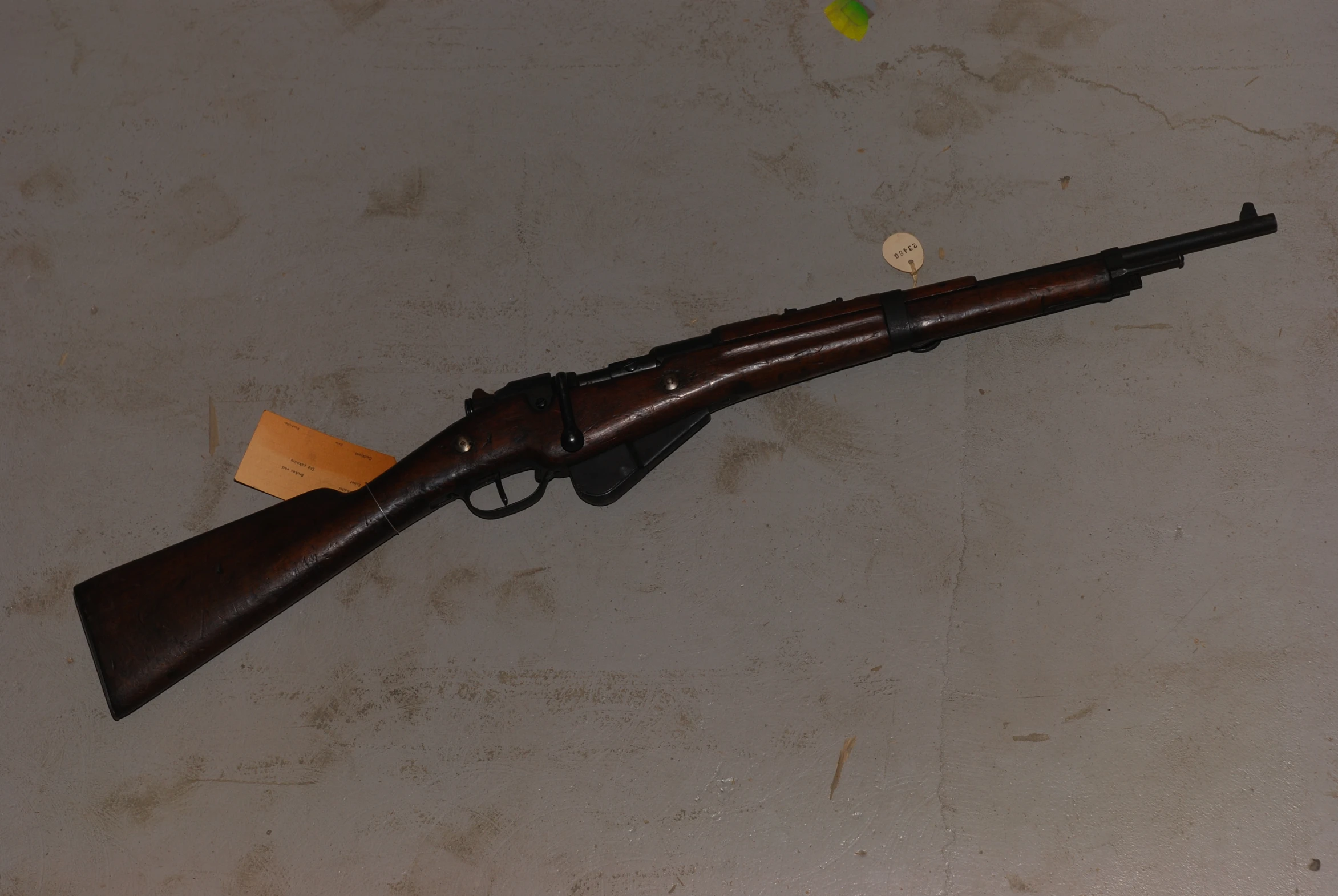 a rifle with an old design and rusty parts