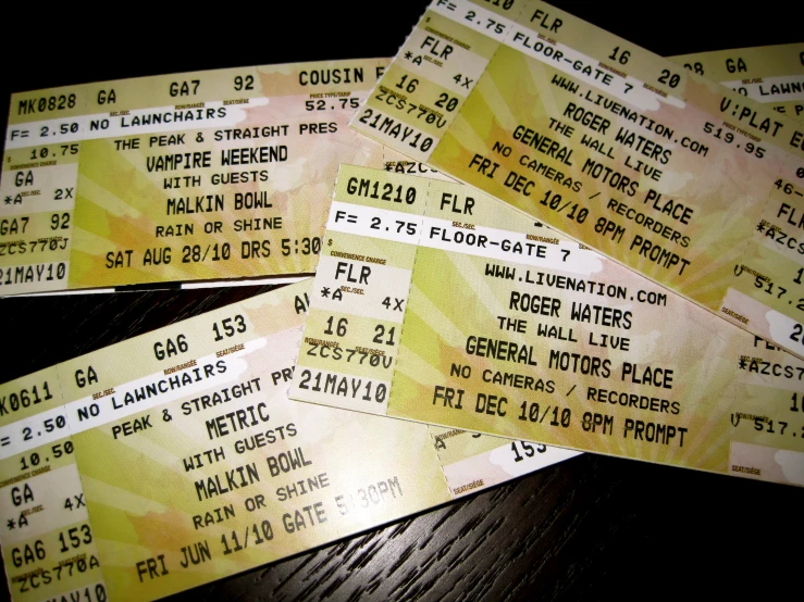 several concert tickets are shown in three rows