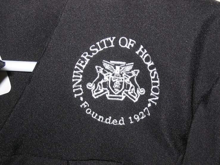 the back and shoulder of a black jacket with the seal on it