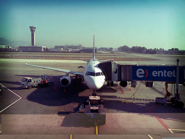 a large jetliner sitting on top of an airport tarmac