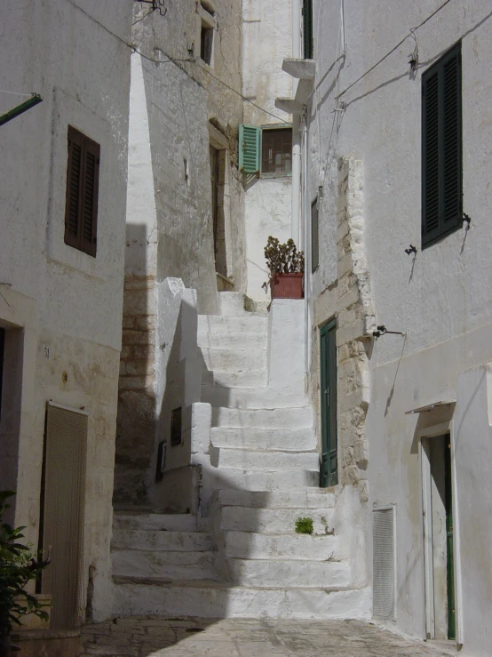a group of stairs leading up the side of some buildings