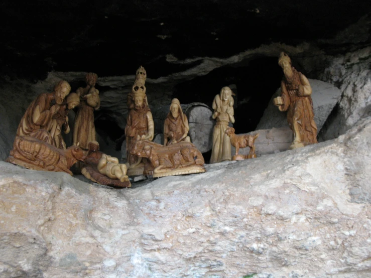 small carvings in a cave near rocks in a park