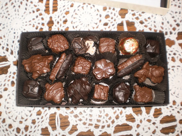 a box filled with chocolates on top of a table