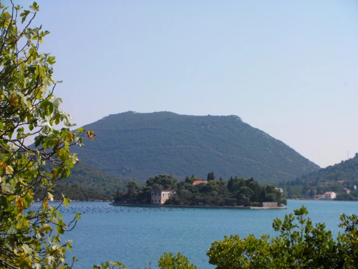 some water hills and a house near a hill