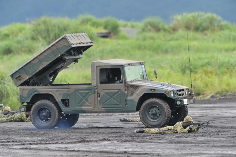 a military vehicle with two people in the back