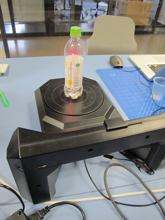 a bottle is sitting on top of a stove