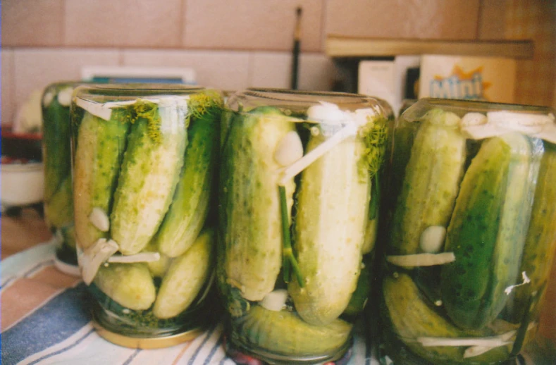 jars with pickles on a table in the kitchen