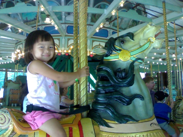 the  is riding the merry go round