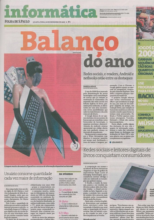 the front page of a newspaper with someone typing on a laptop