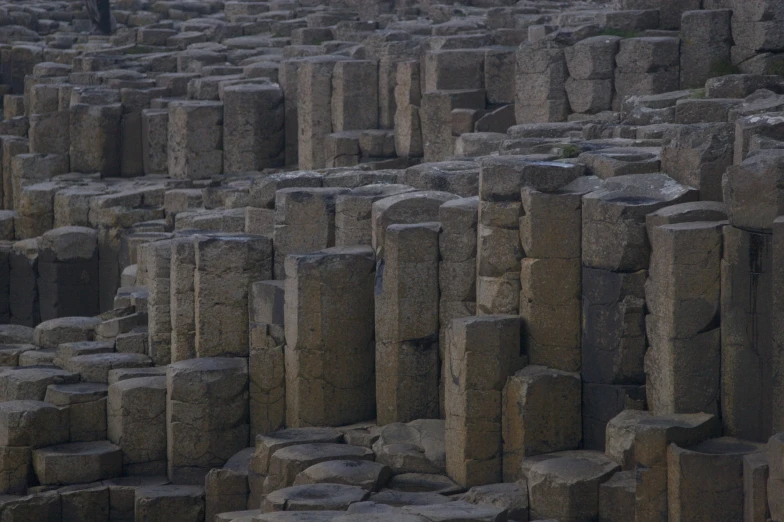 huge blocks of rock in a stone walled area
